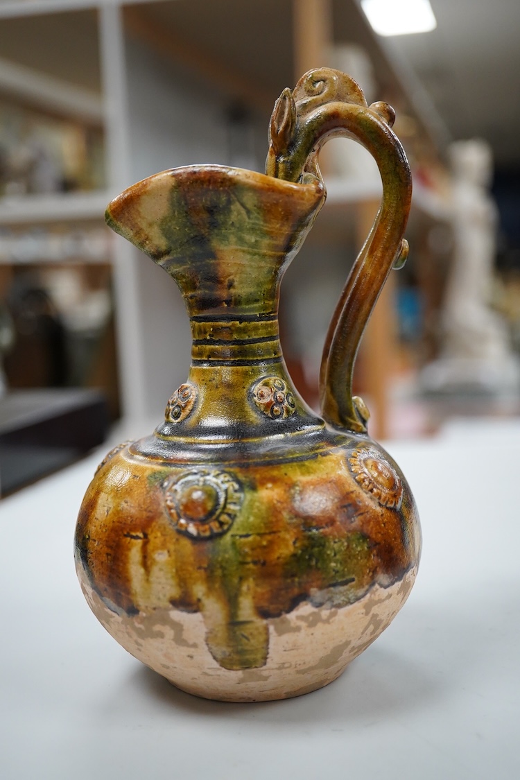 A Chinese pottery jug, two hardstone discs and a metal seal. Jug 17.5cm high